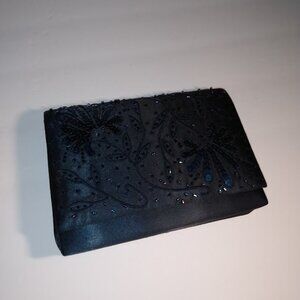 Nytlites: formal black evening bag also has a corded shoulder strap.